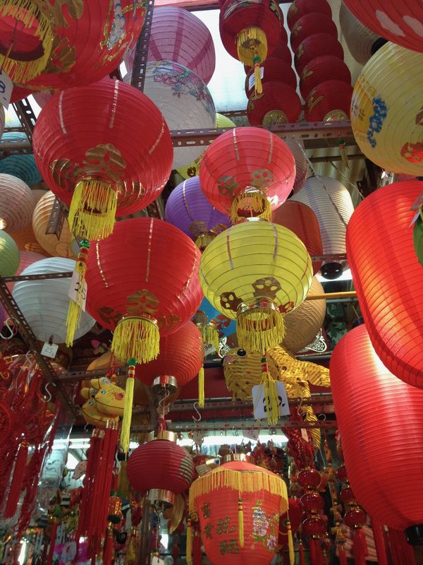 Red and gold lanterns hanging in a Hong Kong market