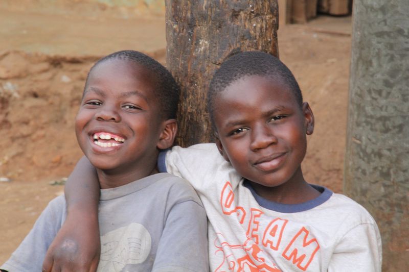 Two boys laughing together in Kenya
